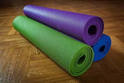 Yoga mats on wooden floor