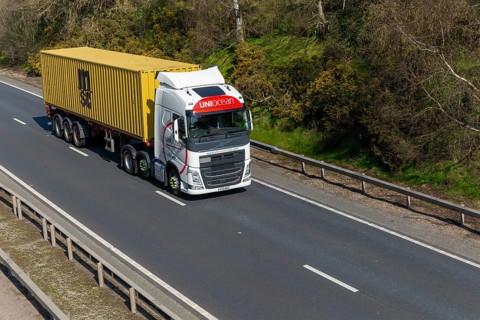 Uniocean heavy goods vehicle carrying MSC container, A14, near Felixstowe, Suffolk, England, UK
