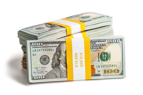 Creative business finance making money concept, stack of bundles of 100 US dollars 2013 edition