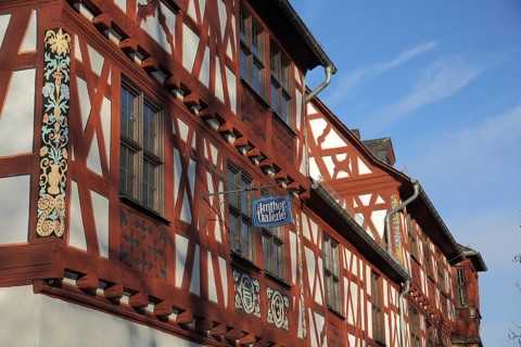 Historic Amthof and landmark, half-timbered house, nose sign, gallery, Bad Camberg, Taunus, Hesse,