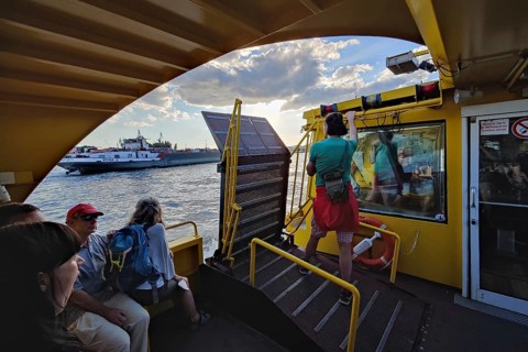 Passengers on a harbour ferry on the Norderelbe, Hamburg, Germany, Europe