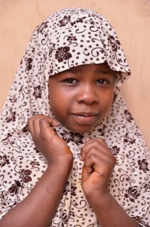 Girl wearing a headscarf, Stone Town, Zanzibar City, Zanzibar, Tanzania, Africa