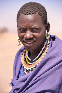 Maasai man wearing traditional dress, Ngorongoro Conservation Area, Ndema, Tanzania, Africa