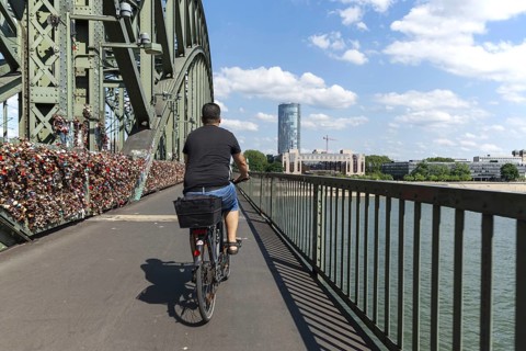 Cycling from a first-person perspective on a shared footpath and cycle path over the Hohenzollern