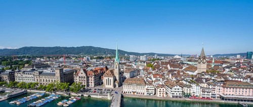Panorama, view over the old town of Zurich with river Limmat, church Fraumünster and Münsterbrücke,