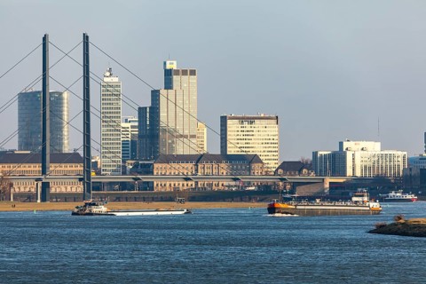Düsseldorf, city centre skyline, skyscrapers, Rheinkniebrücke, Rhine, cargo ship