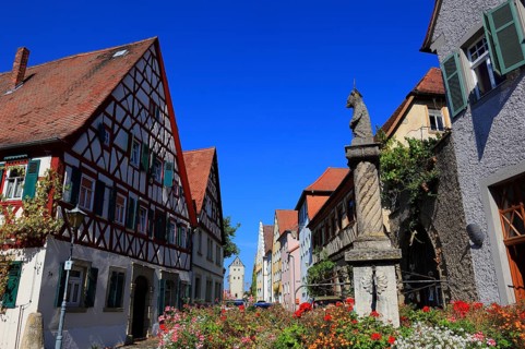 Typical Franconian village centre and the four-tube fountain in the village centre, Mainbernheim,