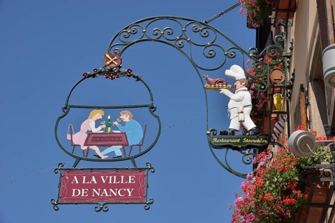 Hanging sign on an Alsatian restaurant, Eguisheim, Département Haut-Rhin, Alsace, France, Europe