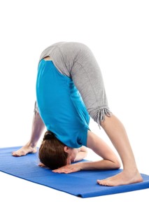 Yoga, young beautiful slender woman yoga instructor doing Wide Legged standing Forward Bend A