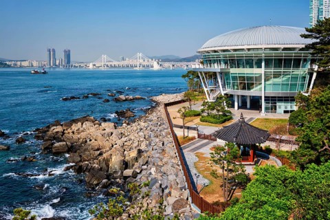 BUSAN, SOUTH KOREA, APRIL 13, 2017: Nurimaru APEC House on Dongbaek island and Gwangan bridge in