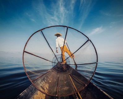 Myanmar travel attraction, Traditional Burmese fisherman with fishing net at Inle lake in Myanmar,