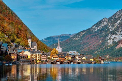Austrian tourist destination Hallstatt village on Hallstatter See lake in Austrian alps in autumn.