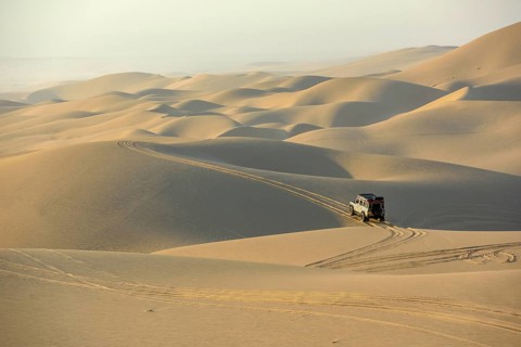 Vehicle in the dunes near Sandwich Harbour, Namib-Naukluft-Park, Namibia, Africa