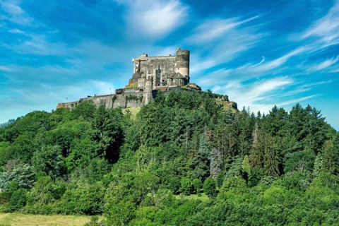 Murol castle built on a basalt promontory in the 13th century. Auvergne Volcanoes Natural Park. Puy