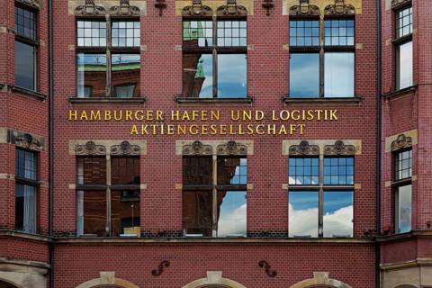 Hamburger Hafen und Logistik Aktiengesellschaft, abbreviated HHLA, lettering on a facade,