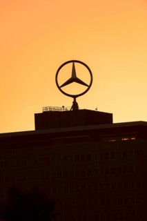 Mercedes star on Mercedes Benz branch in Stuttgart, after sunset, Baden-Württemberg, Germany,