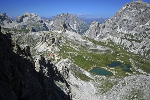 Via ferrata de Luca near Tre Cime di Lavaredo, Drei Zinnen. View on the mountain refuge Rifugio Tre