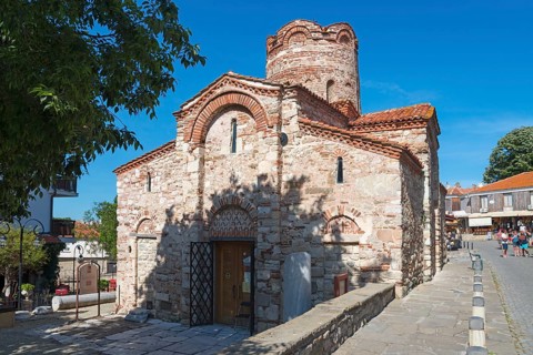 Old Byzantine church with characteristic brick architecture and small windows, Church of St John