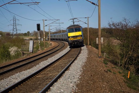 Greater Anglia Class 90 electric locomotive train on the Norwich to London line, England, UK