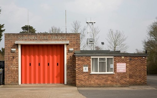 Red doors of small fire station at Loddon, Norfolk, England, United Kingdom, Europe