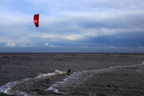 Kite surfing in North Sea at Shingle Street, Suffolk, England, UK
