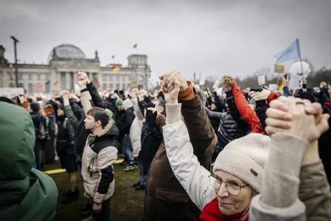 People hold hands at the large demonstration against the right in Berlin under the slogan We are