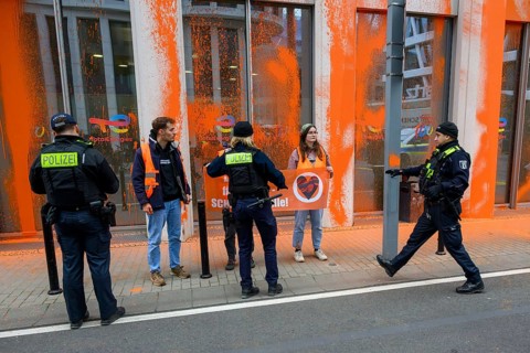 Police confiscate Last Generation banner after colour attack on Total Energies building Berlin, 06