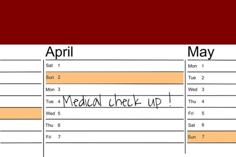 Symbolic image: Appointment diary with note for preventive medical check-up (English)