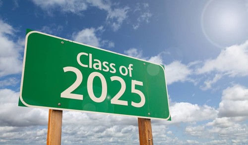 Class of 2025 green road sign over clouds and blue sky