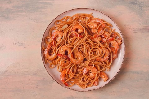 Spaghetti with king shrimps, with spices, top view, selective focus, homemade, no people