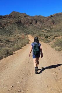 Woman walking in Cabo de Gata national park, Monsul, near San José, Almeria, Spain, Europe