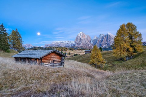 Autumn on the Seiser Alm, Alpine huts with Plattkofel and Langkofel, blue hour, full moon,