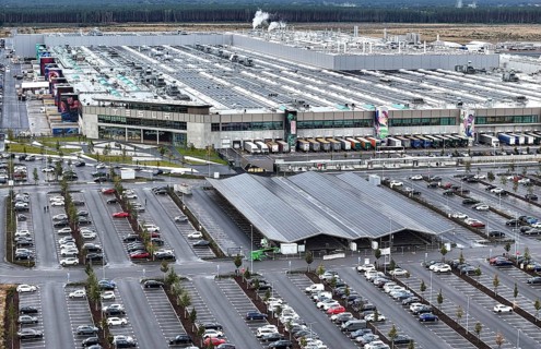 Tesla Giga Factory on the A10 motorway, on the right of the picture is a photovoltaic system above