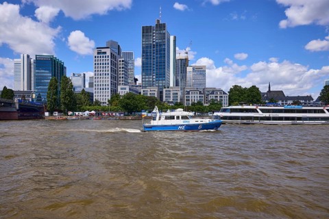 Police boat Hesse 6 on the Main and high-rise buildings in Frankfurt am Main, district-free city,