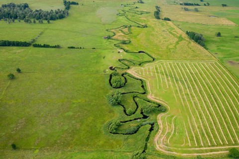 Aerial view over meander belt in meandering Klingavälsån river, tributary to Kävlingeån in the