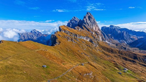 The Sas Rigais and Furchetta peaks of the Odle Group, drone shot, Val Gardena, Dolomites,