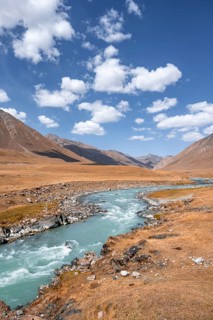 Burkhan valley with blue river, mountain landscape with golden meadows, Terskey Ala-Too, Tien Shan,