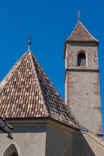 Church in the village of Montiggl, colourful shingle roof, on the South Tyrolean Wine Road, near