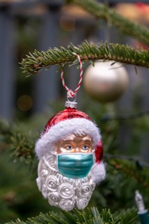 Symbolic image of Christmas in the Corona crisis, Father Christmas figure, Christmas tree