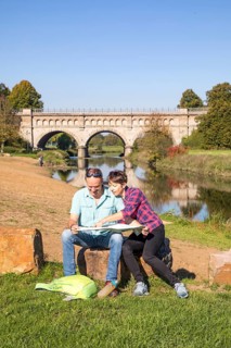 Hikers in the Steverauen Olfen, Alte Fahrt canal bridge, of the Dortmund-Ems Canal, a renaturalised