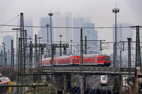 Railway tracks with regional trains, after freezing rain, in front of Frankfurt main station,