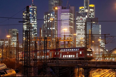 Railway tracks in front of the main railway station in Frankfurt am Main, skyline of skyscrapers in