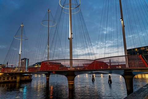 Cyclists on the Cirkelbroen cycle and pedestrian bridge, over the harbour, in the Christianshavens