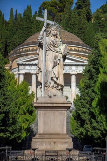 Large statue of a saint at the entrance to the Staglieno Monumental Cemetery, Cimitero Monumentale