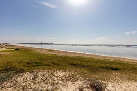 Sunny beach shot with calm coastline and clear sky, Tarifa