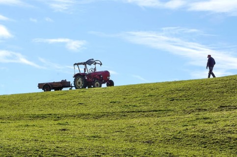 A farmer walks to an old tractor, Nesselwang, 14.10.2021