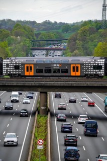 Rhine-Ruhr-Express, RRX train crossing the A3 motorway, traffic on 8 lanes, including the