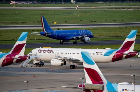 Düsseldorf Airport, ITA Airways Airbus A319-100 on the taxiway, Eurowings Airbus at outside