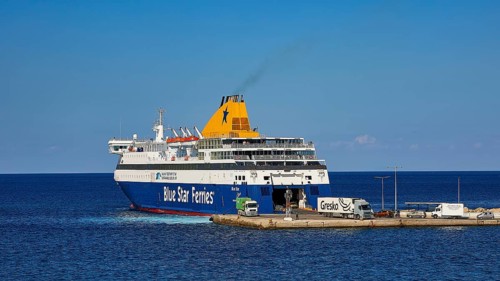 Large ferry of Blue Star Ferries at the harbour, ready for departure on clear and calm sea,