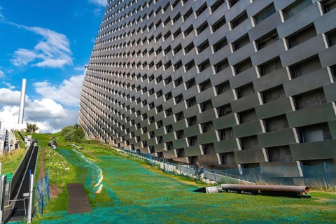 CopenHill, waste incineration plant and artificial ski slope, skiing with a view of the ski lift,